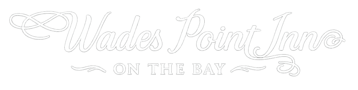 Text logo for Wades Point Inn on the Bay.
